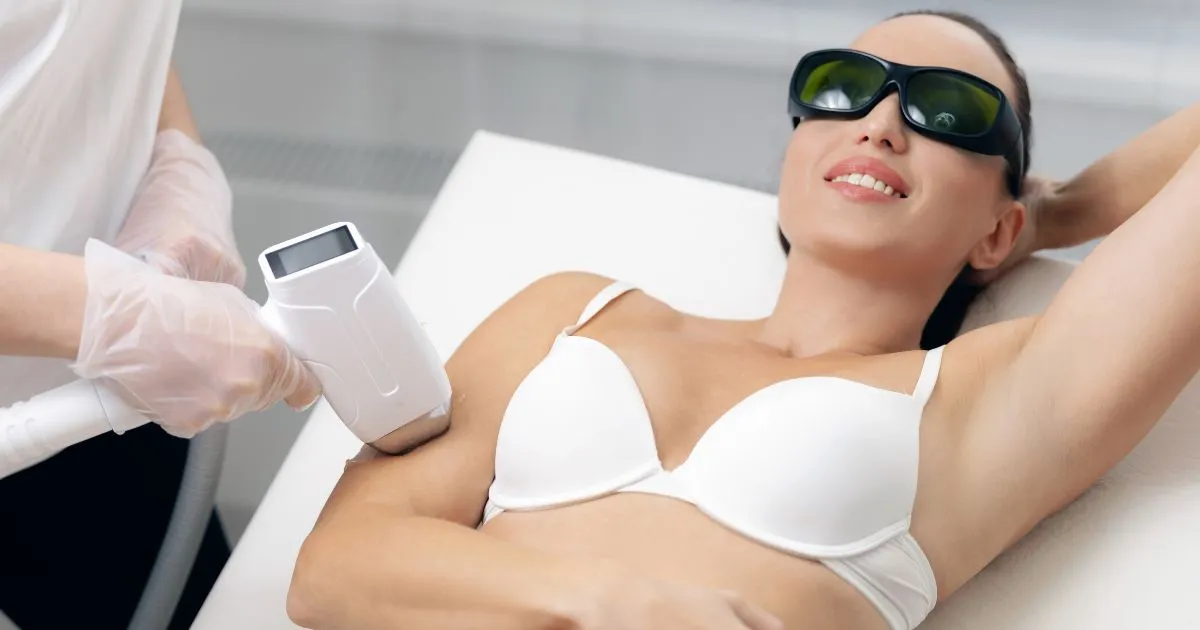Woman receiving Laser Hair Removal on her arm in Akron, OH clinic